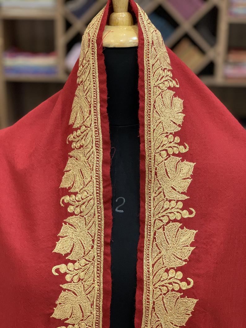Red Pure Pashmina Shawl with Gold Silver Hand Tilla Work close up Red Pure Pashmina Shawl with Gold Silver Hand Tilla Work close up