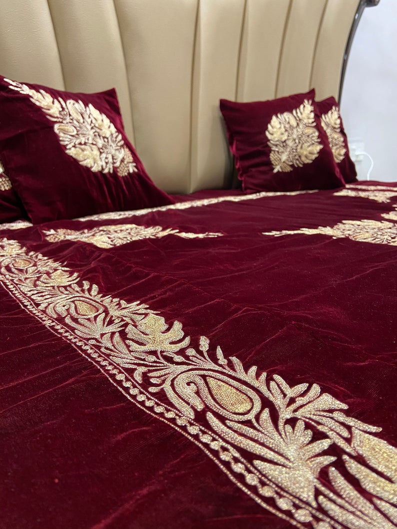 Maroon Velvet Bed Cover with Kashmiri Tilla Embroidery: Chinaar Ambi Border Maroon Velvet Bed Cover with Kashmiri Tilla Embroidery: Chinaar Ambi Border