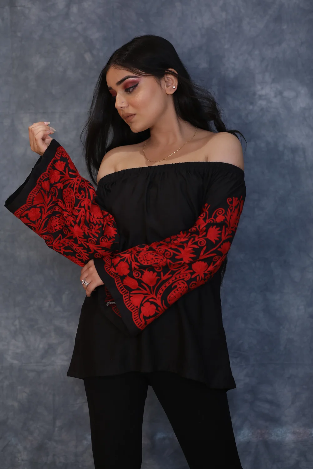 Black Off Shoulder Top with Red Embroidered Sleeves front Black Off Shoulder Top with Red Embroidered Sleeves front