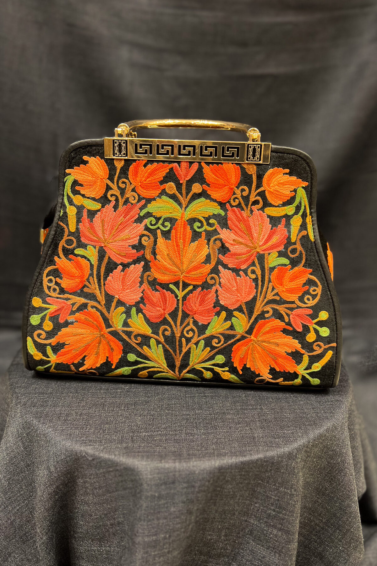 Introducing our stunning Kashmiri Aari Embroidered Women Hand Bag, the perfect accessory to elevate any outfit. Crafted with precision and care, this bag is a testament to the rich cultural heritage of Kashmir. This lightweight handbag with its spacious interior is perfect for daily use or special occasions. The floral Aari work pattern adds a touch of elegance and sophistication. The two handles give you a comfortable grip to hold and it is easy to carry. Our Kashmiri Aari Embroidered Women Hand Bag is the perfect accessory to complete your look. Buy yours today and add a touch of luxury and style to your wardrobe!