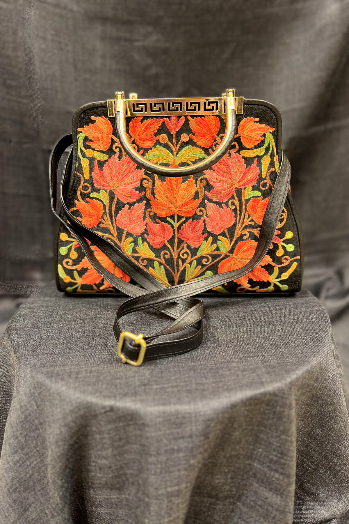 Introducing our stunning Kashmiri Aari Embroidered Women Hand Bag, the perfect accessory to elevate any outfit. Crafted with precision and care, this bag is a testament to the rich cultural heritage of Kashmir. This lightweight handbag with its spacious interior is perfect for daily use or special occasions. The floral Aari work pattern adds a touch of elegance and sophistication. The two handles give you a comfortable grip to hold and it is easy to carry. Our Kashmiri Aari Embroidered Women Hand Bag is the perfect accessory to complete your look. Buy yours today and add a touch of luxury and style to your wardrobe!